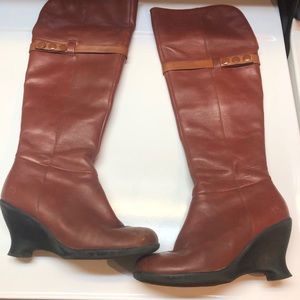 John Fluevog knee high deep rust leather boots.